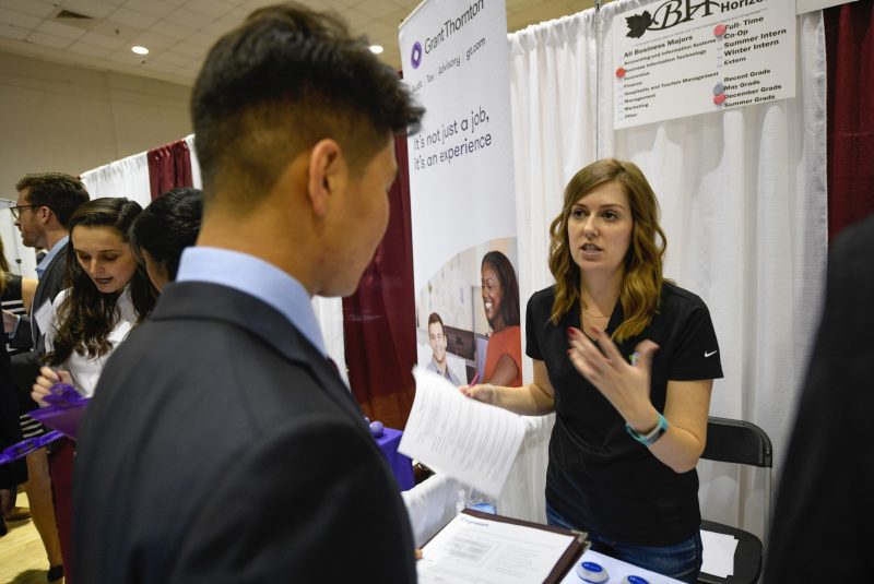 A student meets a recruiter at the Pamplin College of Business fall 2018 Business Horizons career fair. Photo by David Hungate.